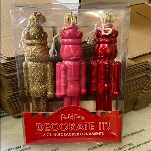 Packed Party Glittering Nutcracker Ornament Trio - Gold, Pink, Red